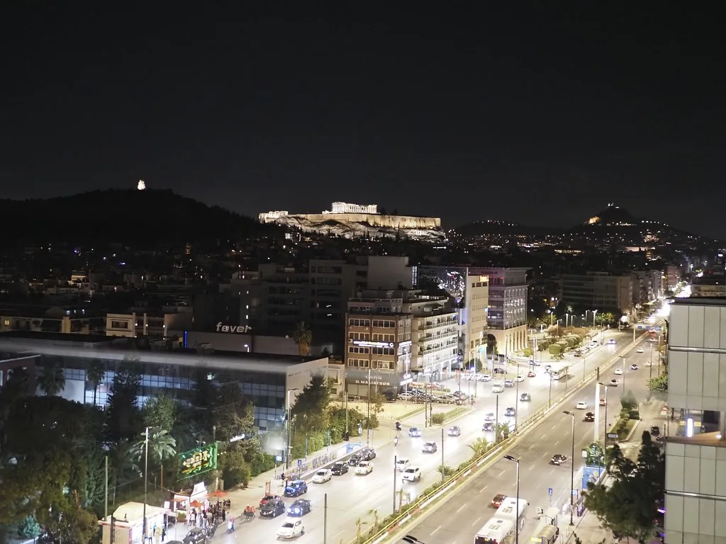 The Acropolis at night, seen from an Athens rooftop.